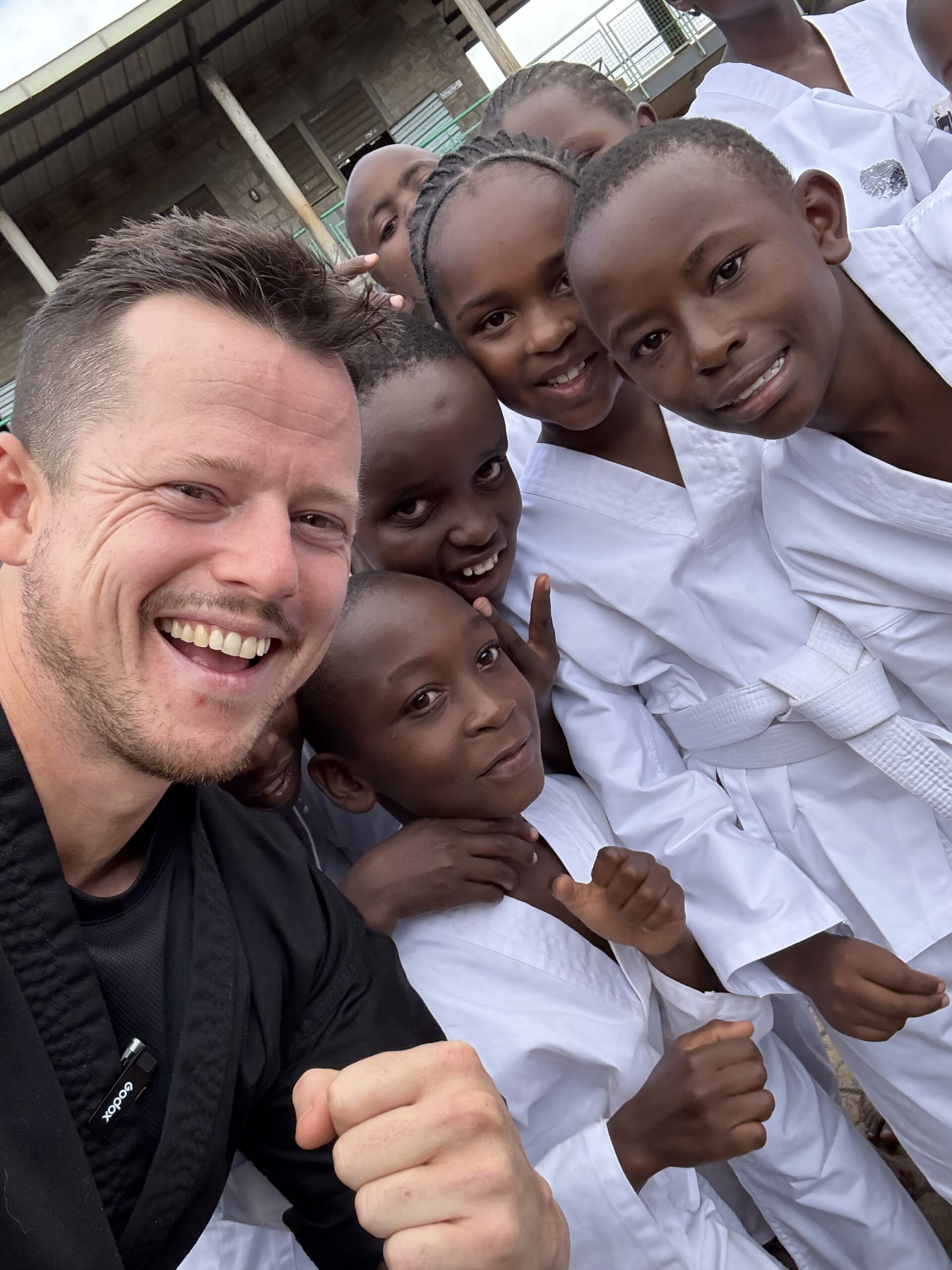 Sebastian Bates with students in Kenya