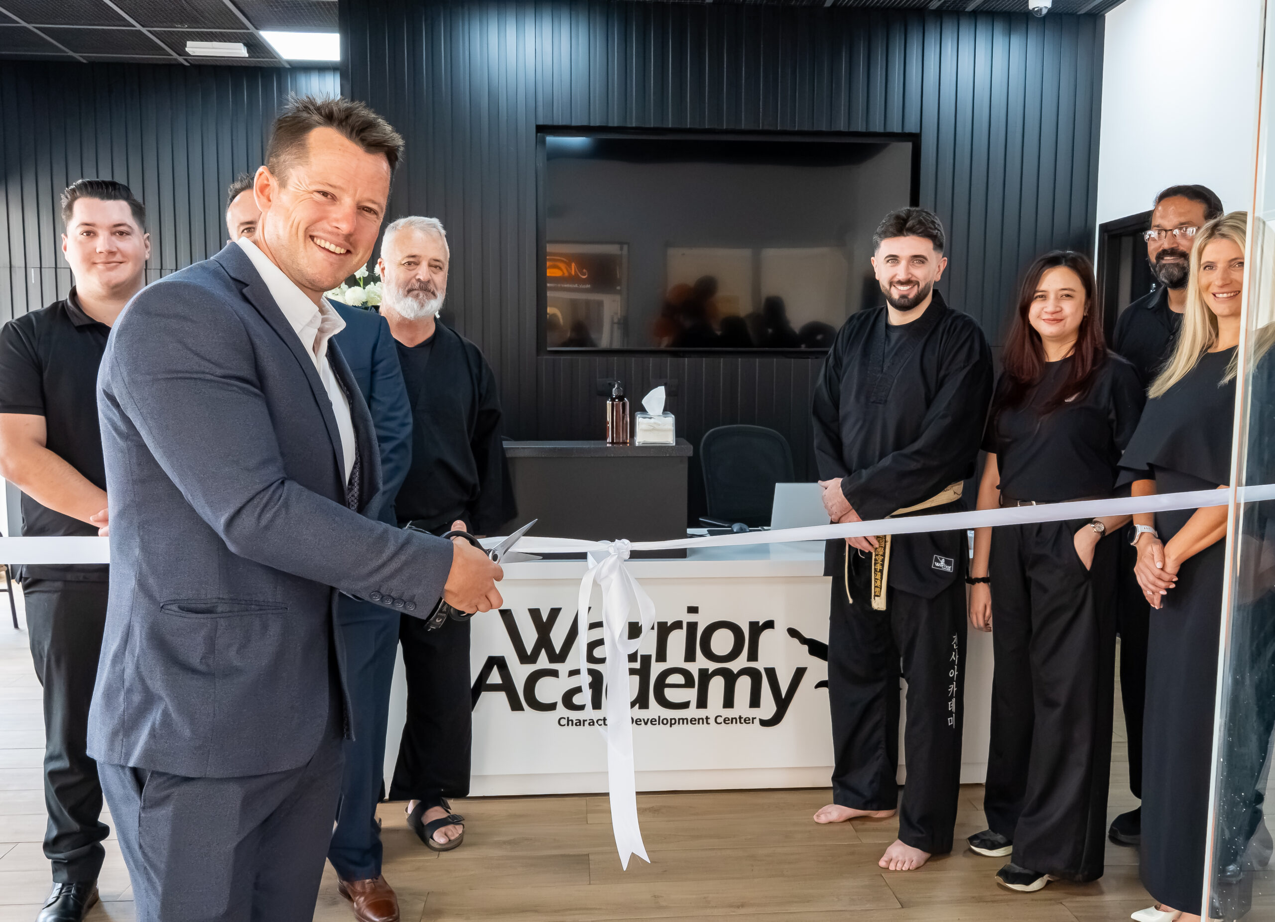 Sebastian Bates cutting the ribbon at the Jumeirah Islands academy